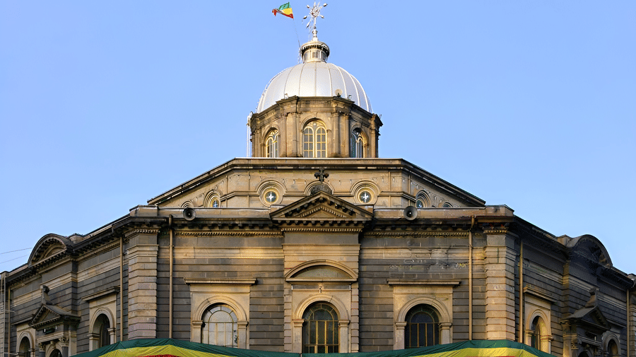 The domed facade of Cathedral decorated with Ethiopian flag colours
