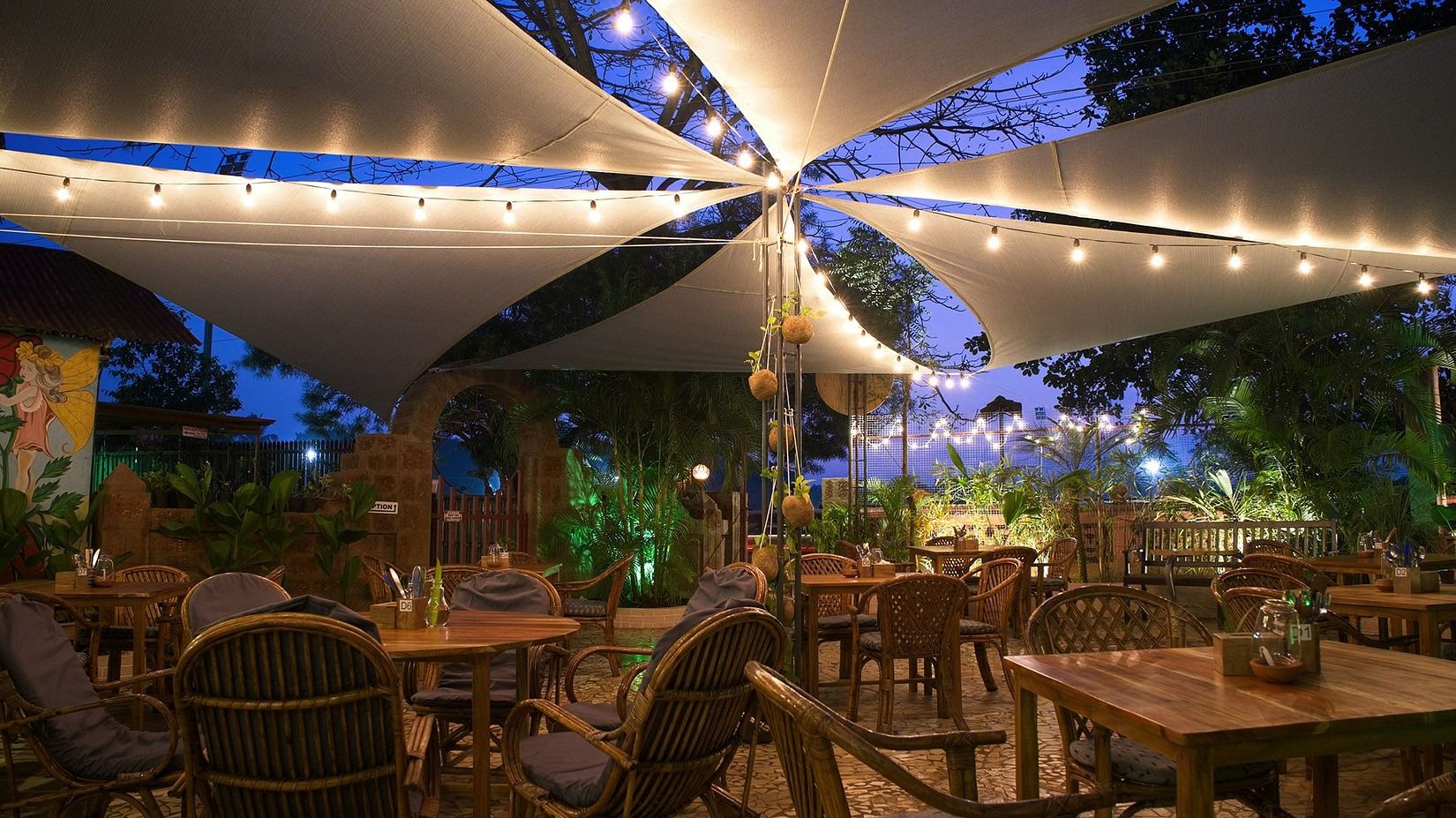 a well-lit restaurant at night at villa in palms