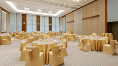 a banquet hall with round table seating  - Karma Lakelands.