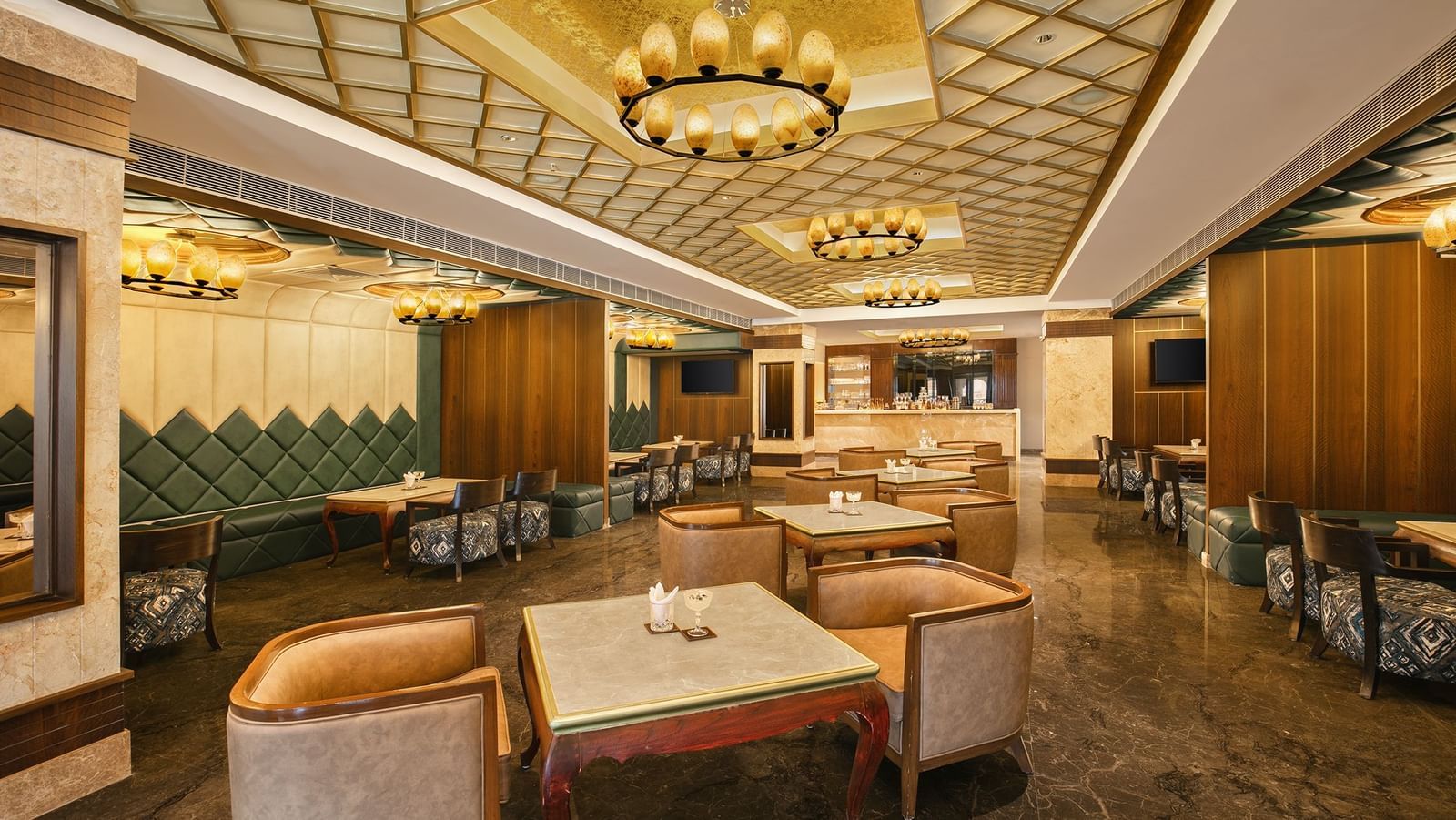 An upscale bar in Mahabalipuram with contemporary interiors and golden accents - Kaldan Samudhra Palace