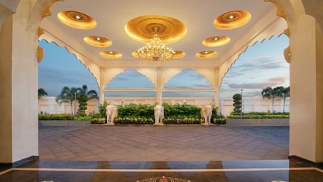 Arched pavilion with ornate ceilings and golden lighting on our front porch - Kaldan Samudhra Palace