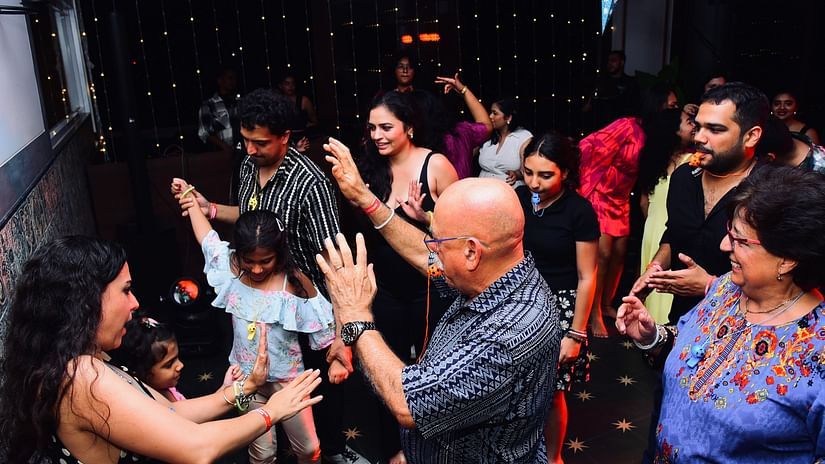 A group of people dancing on the dance floor at Cloud9 Sarovar Premiere, Palolem Goa.