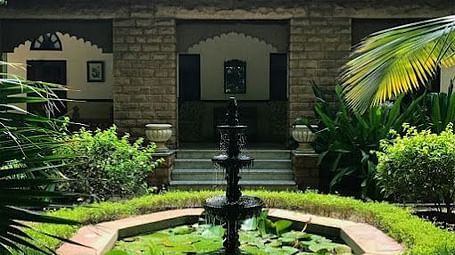 A image of a fountain in lawn of Devi Bhawan