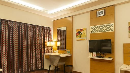 Luxury room with flat screen TV at The President Hotel, Hubli