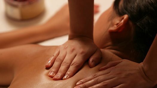 A soothing massage in a tranquil setting, highlighting relaxation and wellness. A perfect escape for rejuvenation | Brewery Gulch Inn & Spa