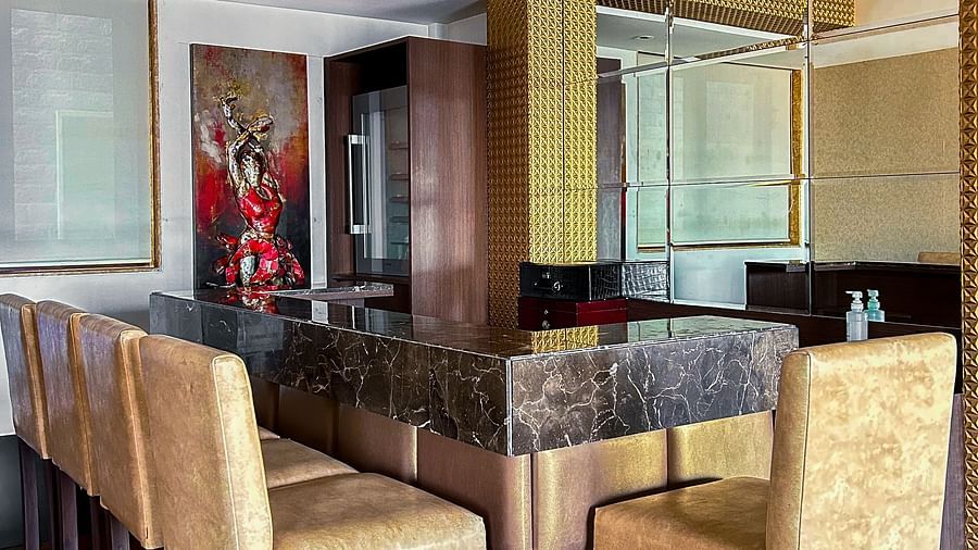Spacious indoor dining room with elegant décor and natural lighting at Aranya Himalayan Retreat