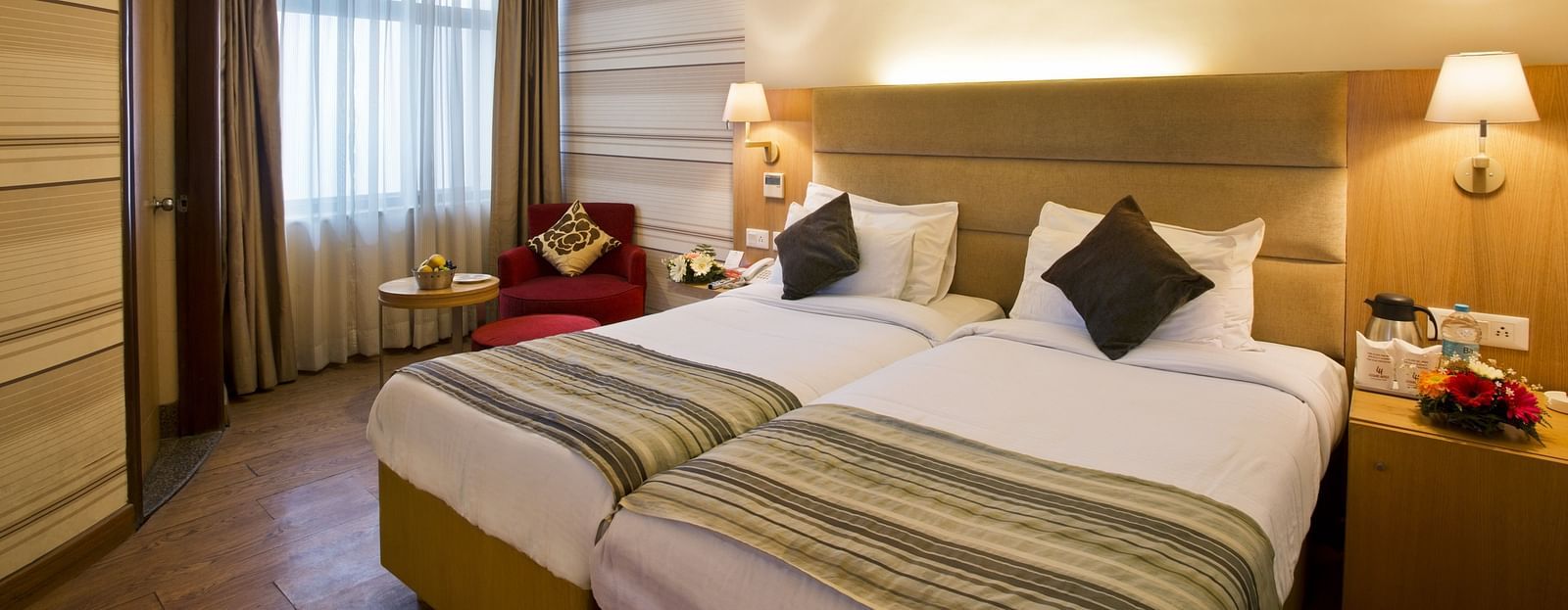 an image of a deluxe room with an air-conditioner at The Manor, Bareilly