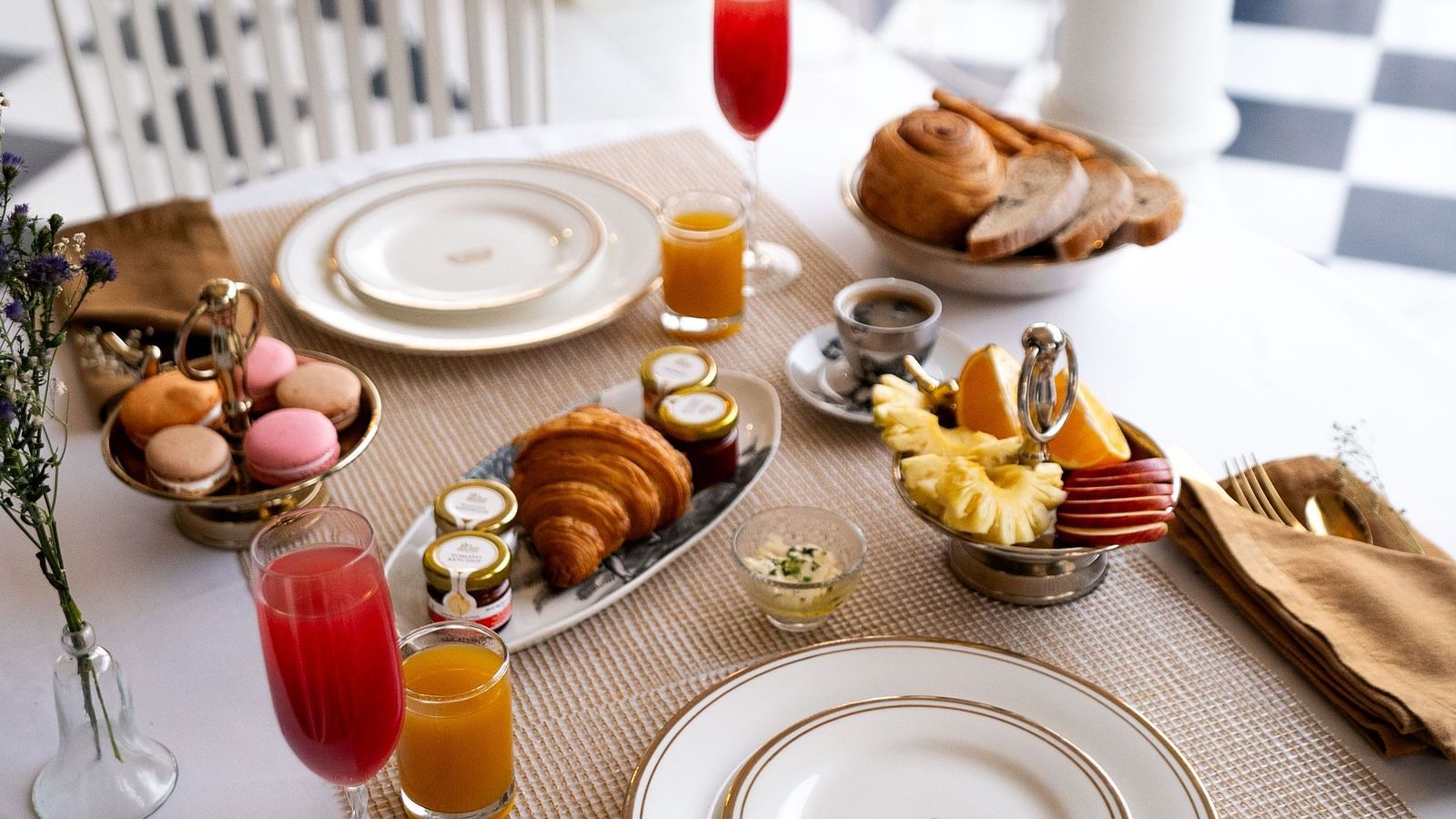 A breakfast table arrangement in the outdoor patio area of Dileep Kothi, Jaipur