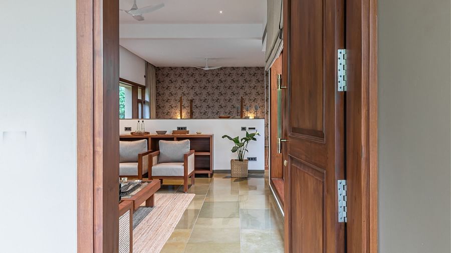 Open doorway leading to a hallway with a rug, view of a room, interior architecture - Shreyas Retreat