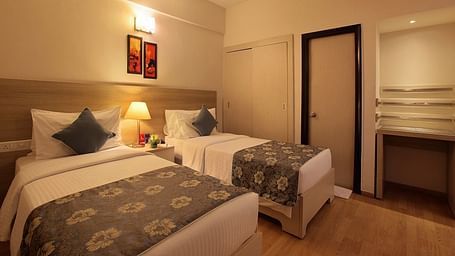 Premium room at Starlit Suites, Bangalore with twin beds