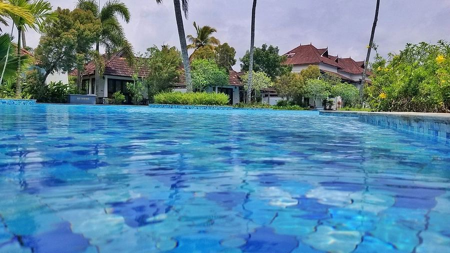 Turquoise blue waters of a swimming pool - Rhythm Kumarakom