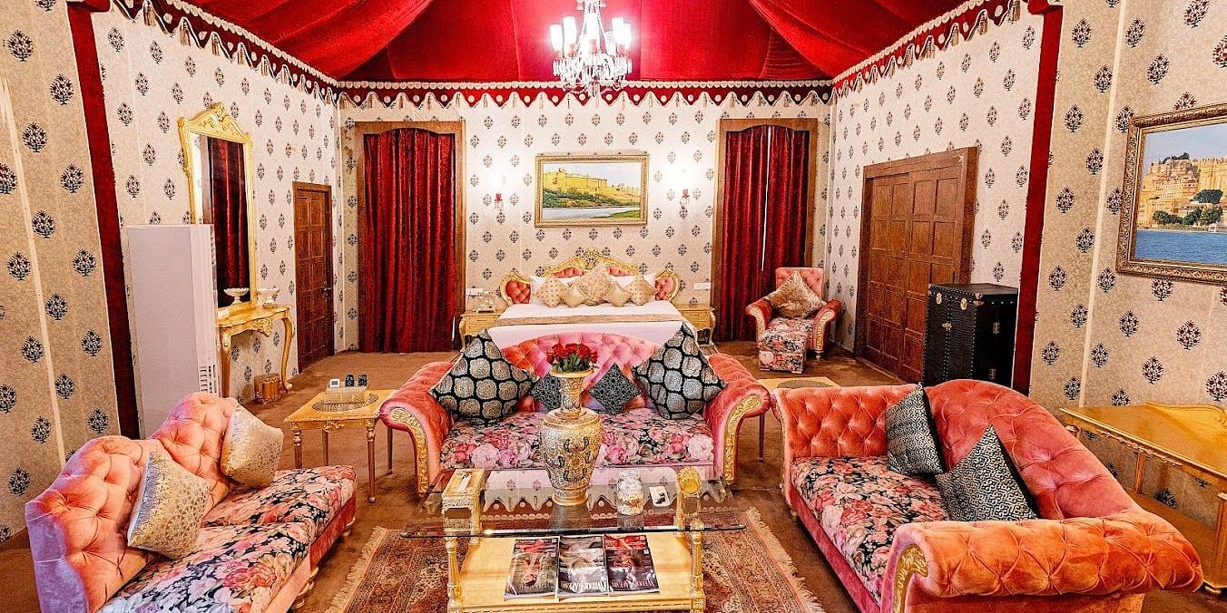 Image of Presidential Suite with sofas and a table in between at Rajasthali Resort & Spa Jaipur.