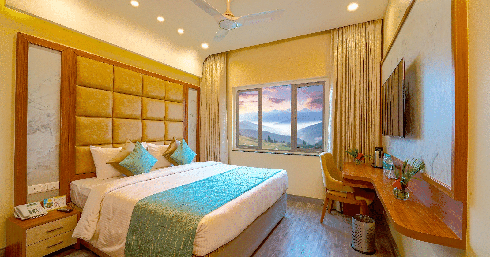 Cozy bedroom with a queen-sized bed, elegant headboard, and large window offering natural light Tara, Comfort Hotel in Hyderabad - Ramoji Film City.