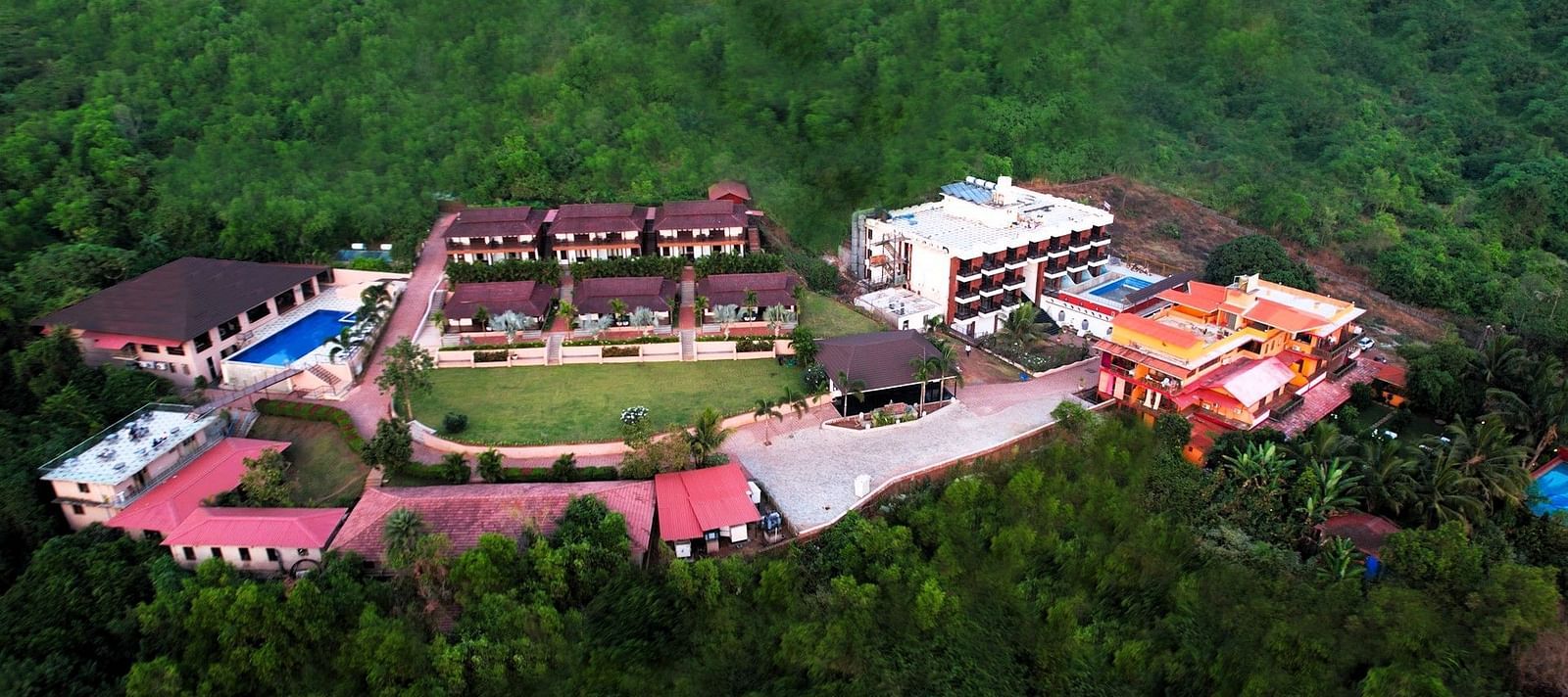 Eagles eye view of a large resort complex in the midst of dense canopy - Crescent Resorts