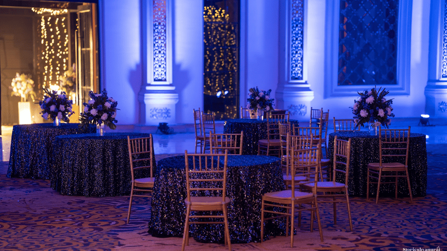 Chairs, tables, and decorations arranged for an event at Valley by Grassfield, a wedding resort in Jaipur.