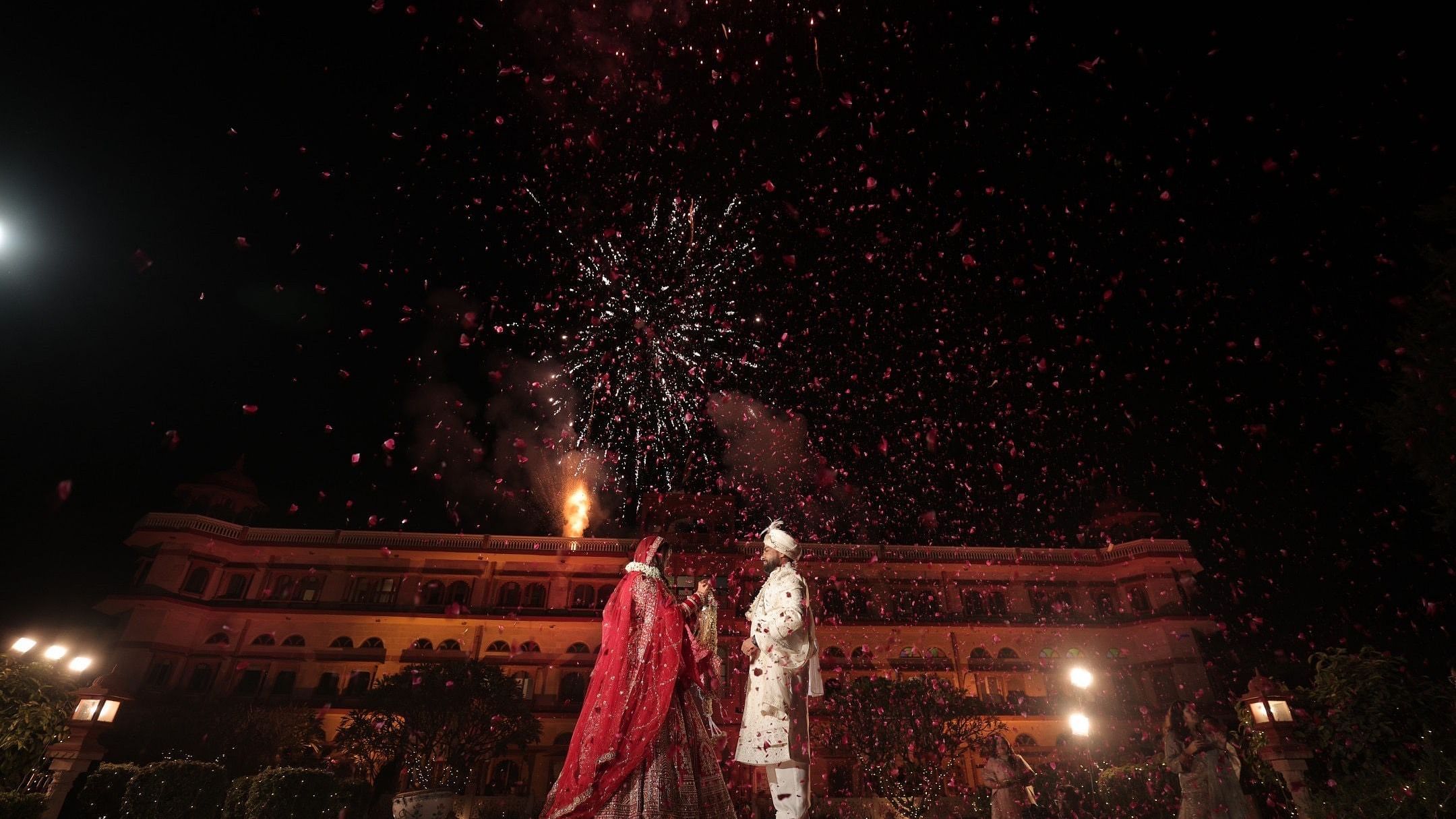 Advait & Akshay under a sky full of fireworks during their wedding night at Umaid Palace.