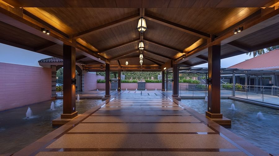 image of a pathway with a roof on the top at a late evening