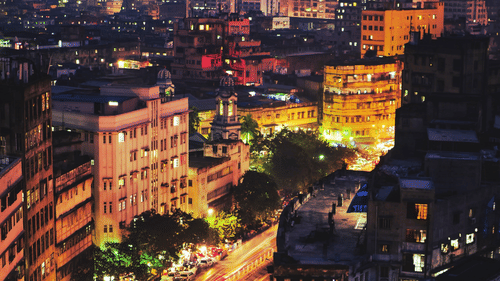 An aerial view of Park Street in Kolkata with a long exposure of vehicles moving on the road as seen during twilight hour.