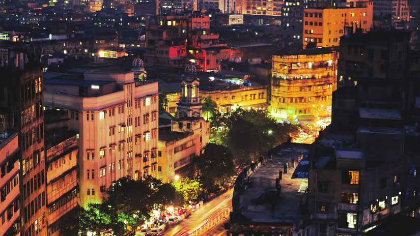 An aerial view of Park Street in Kolkata with a long exposure of vehicles moving on the road as seen during twilight hour.
