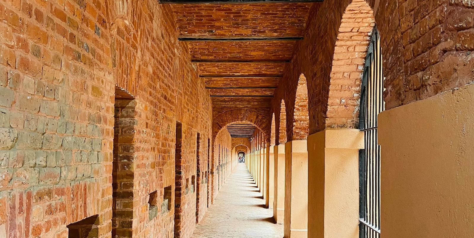 Picutre featuring a long corridor in day time