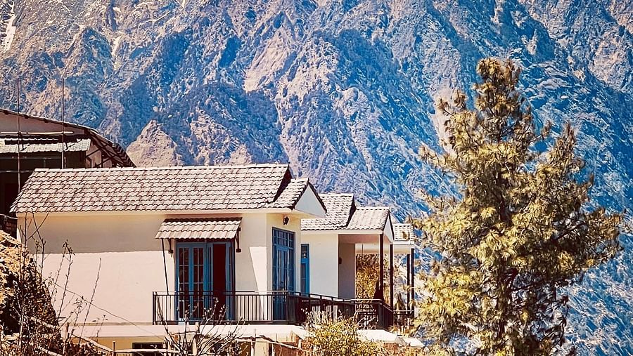 Image of the facade of Faraway Cottages, Auli and mountains in the background | Faraway Cottages, Auli