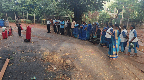 Staff at Black Thunder Water Theme Park attending a fire safety and emergency response training session in an outdoor setting.