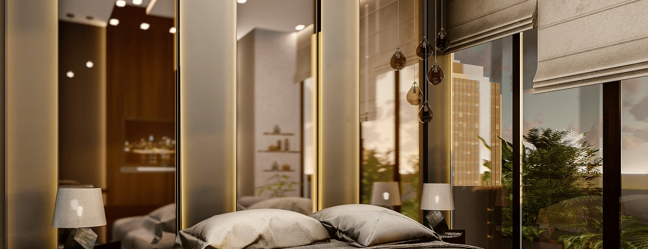 A luxurious bedroom featuring a double bed with few pillows kept over it.