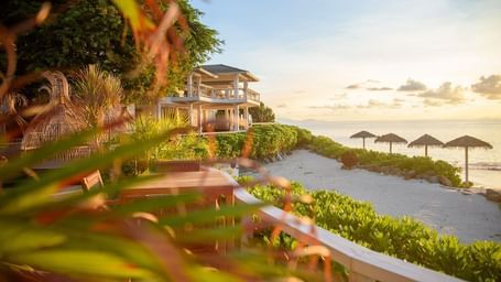 Scenic sunset view of villas overlooking the Caribbean Sea at Tamarind Hills Antigua – Resort & Villas