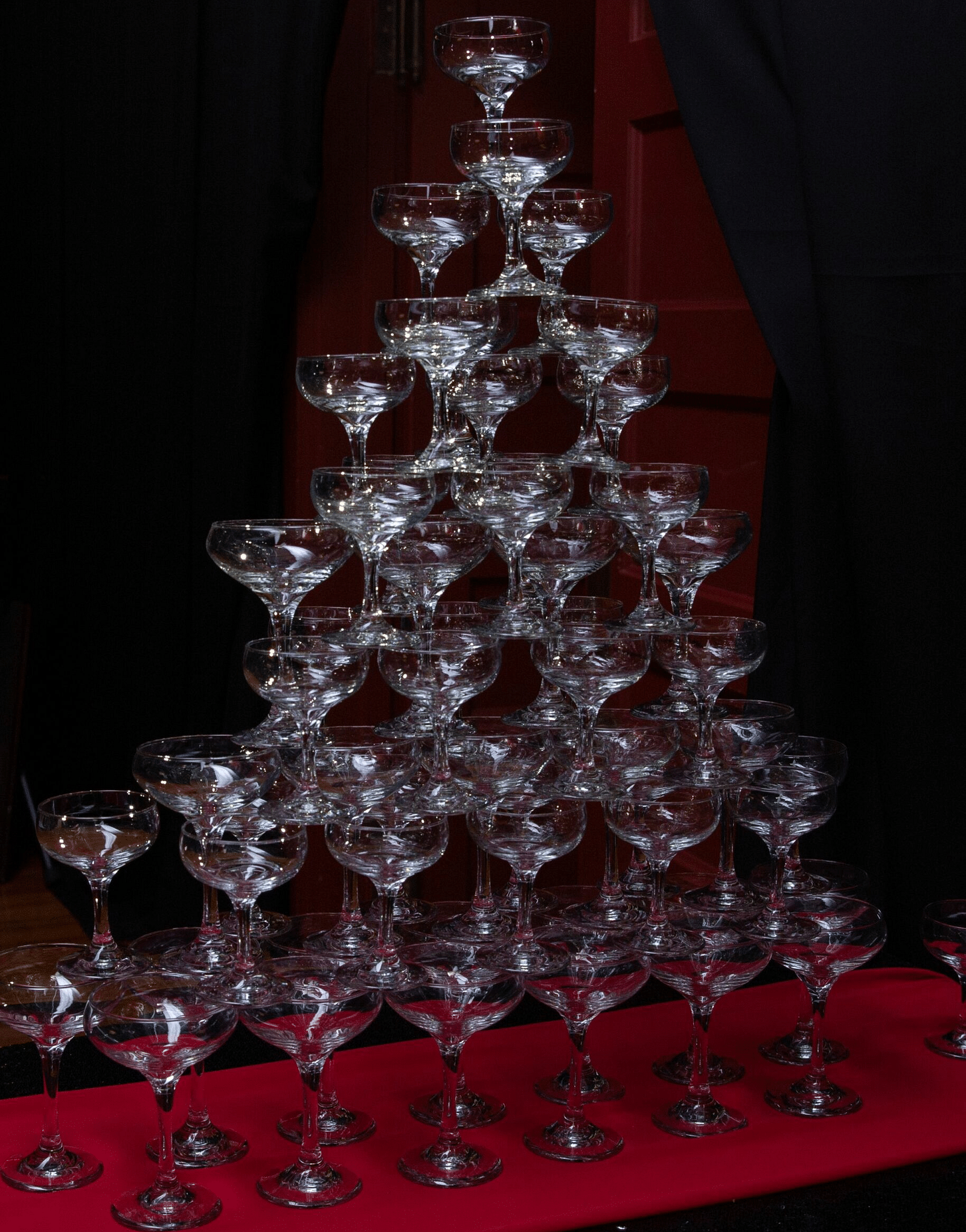 a pyramid of champagne glasses stacked over one another at the Tin Can Theater - Historic Tapoco Lodge