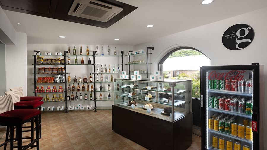 image of a shop featuring a glass door fridge with a variety of canned beverages to choose from