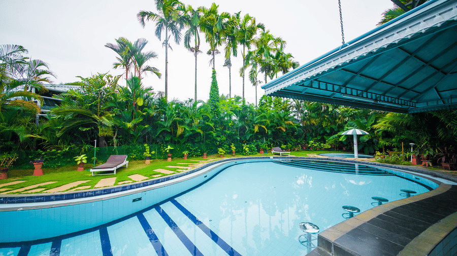 Swimming pool with, clear water, and relaxing outdoor space at the Renai Cochin.