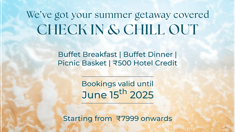 Summer getaway advertisement for The Resort showcasing a beach scene, with an offer including buffet breakfast, buffet dinner, a picnic basket, and ?500 hotel credit; booking validity until 15th June 2025.