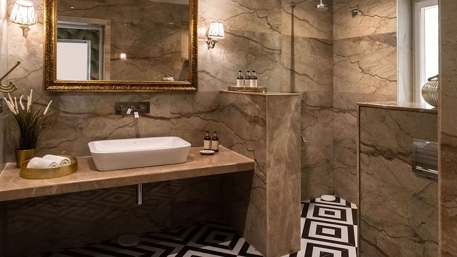 Washroom area at Dileep Kothi, Jaipur with a well-lit vanity and patterned tiles