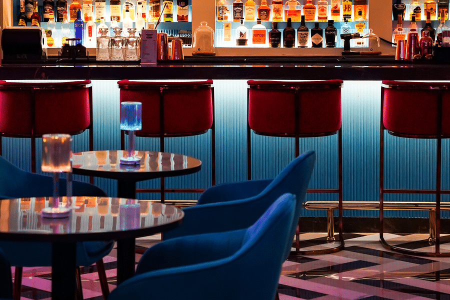 The dining arrangement of Merlins bar at orchid hotel mumbai vile parle