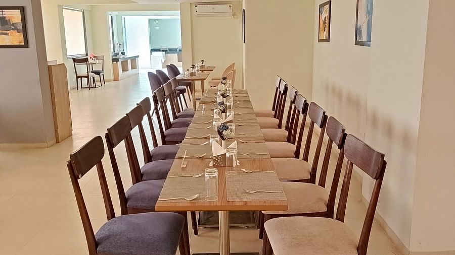 Seating arrangement inside the restaurant 4 - Starlit Suites, Shirdi