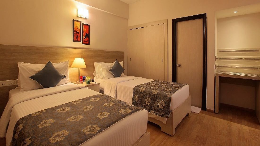 Premium room at Starlit Suites, Bangalore with twin beds
