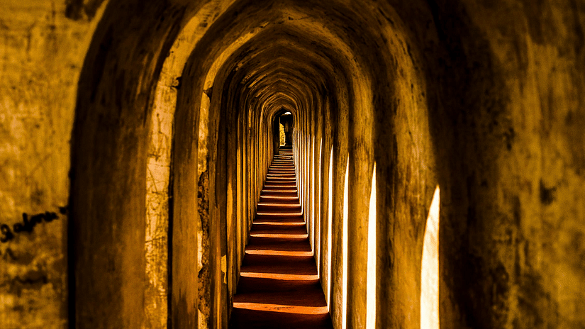 Image of arched wall with sunlight seeping though the openings in the wall - The Dukes Retreat, Khandala