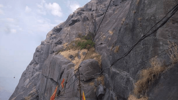 Rocky hillside or cliffside view captured outdoors, highlighting a natural feature nearby.