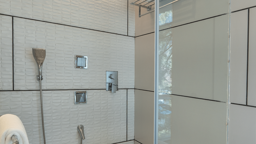 an image of a bathroom with a towel and shower at Mastiff Select Mandavya Dharamkot, McLeodganj