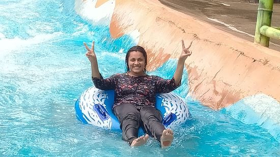 a woman in a floaty at Single Man Ride - Black Thunder, Coimbatore
