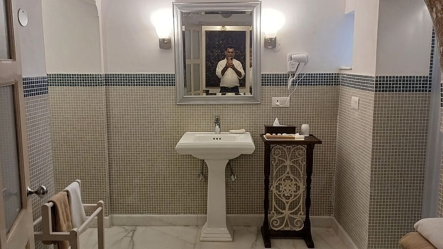 Traditional washroom area with arched architecture and heritage setting at the historic Neemrana Fort-Palace interior.