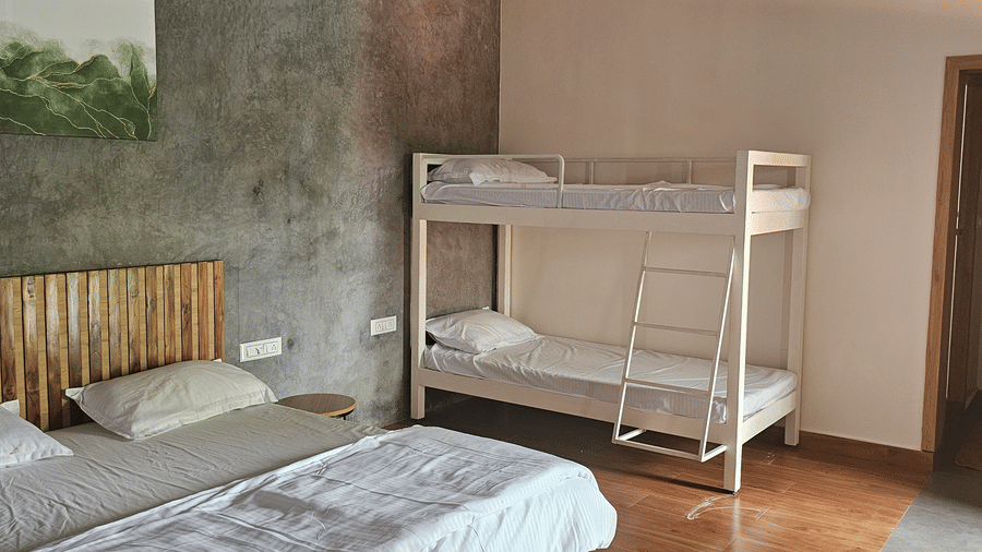 Bedroom with a queen bed, bunk bed, and spacious layout designed for larger groups.