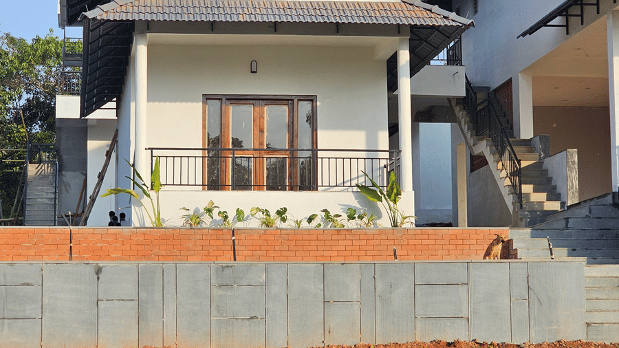 A facade of hillock vista homestay with scenic natural surroundings.