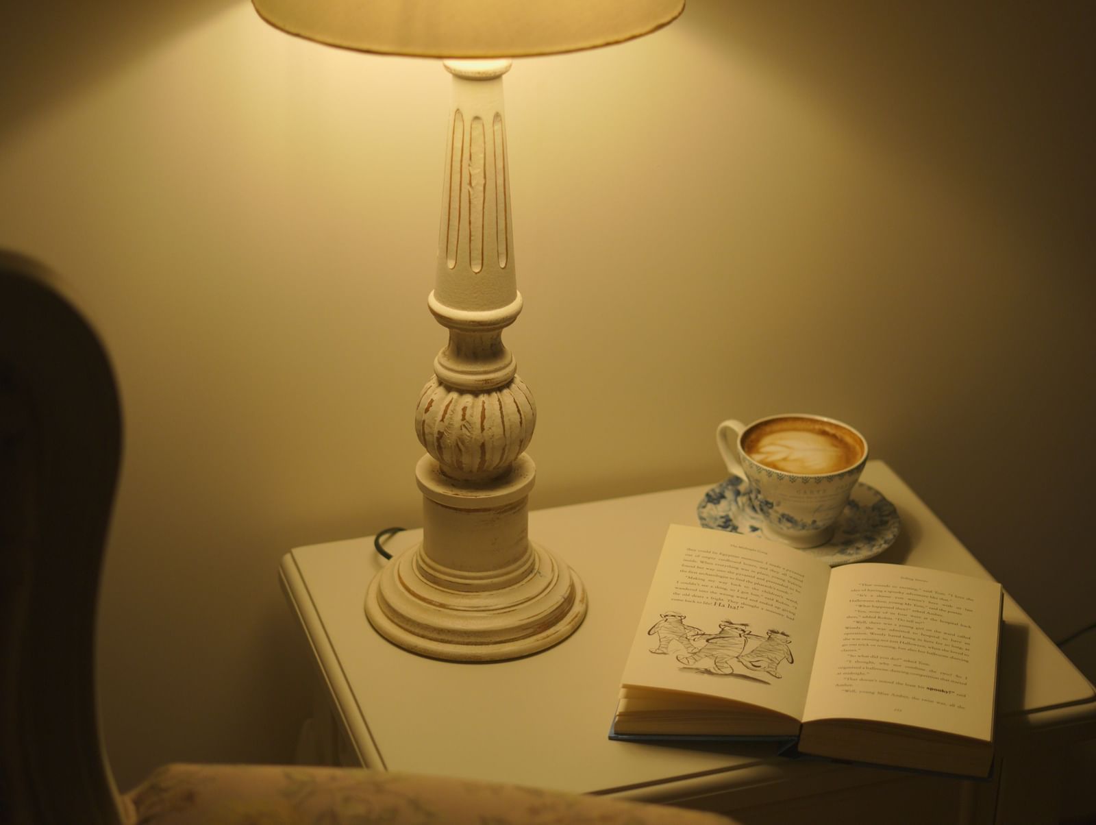 Bedside table with a vintage lamp and a classic rotary dial telephone - Mayfair Cafe & Suites, Dalhousie