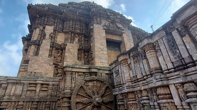 A low angle view of the  stone carved temple with a dramatic sky as the backdrop