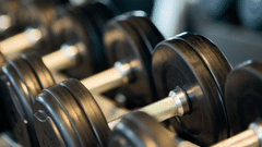 weights stacked one by one at a gym