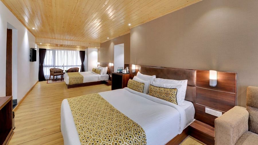 Image of a double bed in the Premium Family Room at Hotel Sumitel Vista T.V Tower 