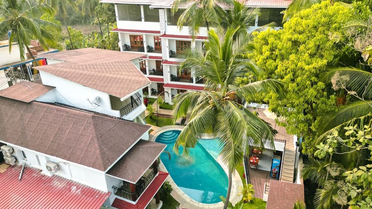 Ariel view of the Verda hotels and resorts with pool and palm trees