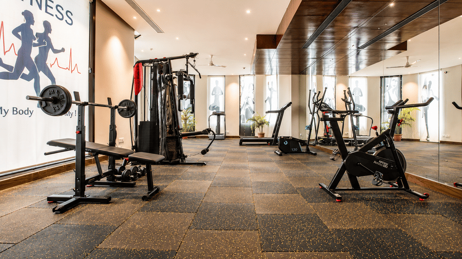 Fitness centre workout area with cardio and strength equipment at Eastlynn Resort, Rishikesh.