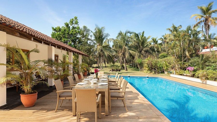The swimming pool and sitting area by it